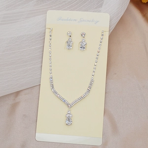 Sparkling silver rhinestone jewelry set with V-shaped necklace and teardrop crystal earrings