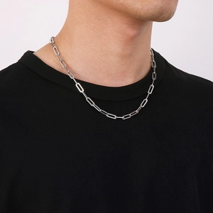 Minimalist silver stainless steel paperclip chain necklace on a female model