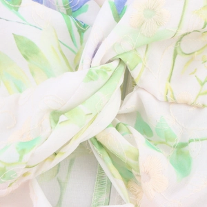 French style floral dress with green leaf embroidery and knot detail at the bust