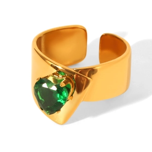 Close-up of heart-cut green zircon inlay on a wide gold-plated stainless steel ring