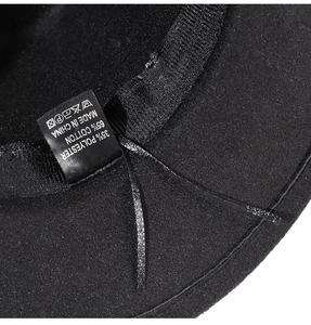Detail view of cotton and polyester blend lining and care label inside the black jazz hat
