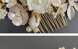 Detailed close-up of wedding hair comb with ceramic flowers, pearls and golden leaves