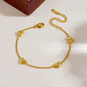 Gold-plated stainless steel chain bracelet with heart pendants and zircon stones