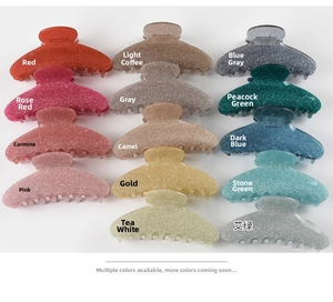 Detailed palette of 14 glitter acrylic hair claws in assorted colors for styling