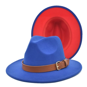 Detail of blue wool felt fedora featuring a contrast red brim and leather buckle band