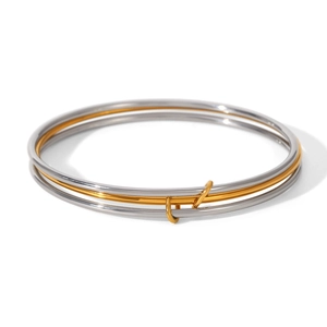 Three-layer stacked stainless steel bangle with polished gold and silver interlocking rings