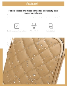 Waterproof khaki nylon fabric detail with quilted pattern and water droplets macro