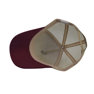 Detailed interior of trucker hat showing sweatband, mesh backing, and care labels