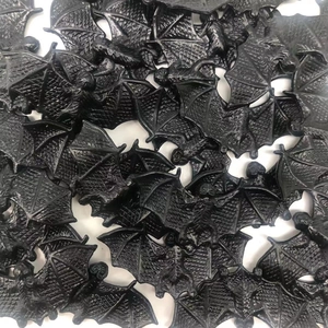 Bulk pack of small black plastic Halloween bats for spooky party decorations and DIY crafts