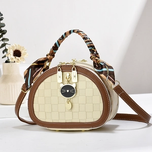 Mini crossbody handbag with checkered pattern, cat pendant, and silk scarf handle
