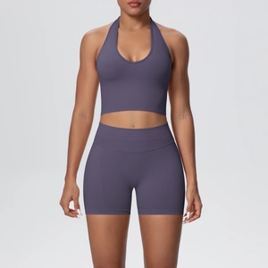 Front view of seamless ribbed halter yoga top and high-waist shorts in dark purple