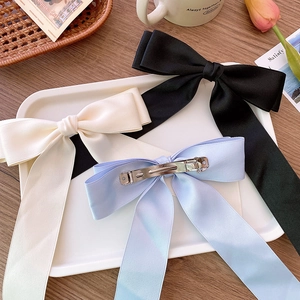 Elegant satin bow hair clips in black, beige and light blue with metal spring fastener