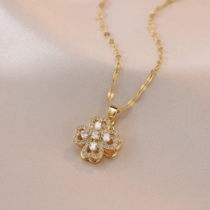 Elegant gold layered flower pendant necklace with clear cubic zirconia inlay details
