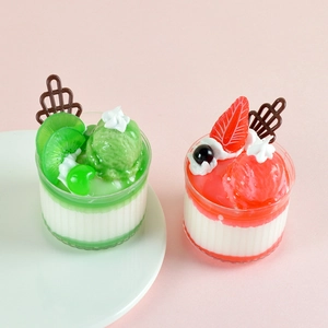 Realistic artificial fruit ice cream sundae models with strawberry and kiwi toppings