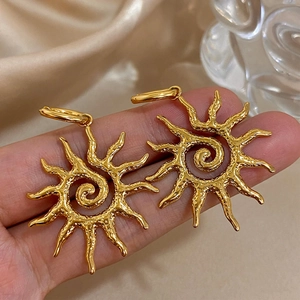 Fashionable golden sun-shaped stainless steel earrings with textured spiral design