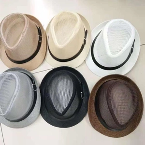Flat lay of breathable mesh fedora hats in six various colors with black decorative bands