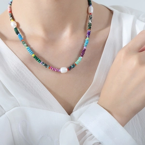 Colorful beaded necklace with natural stones and pearls shown on a female model