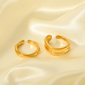 Minimalist 18K gold plated stainless steel open rings on champagne silk background