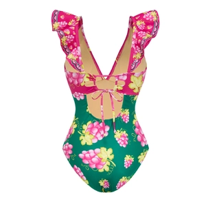Detailed back view of deep V swimsuit with ruffles, grape print and lace-up bow design