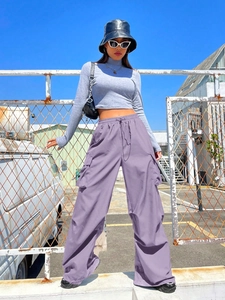 Detail of high-waisted purple cargo pants with drawstring and side pocket for women