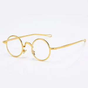 Retro-Rundbrille aus goldenem Metall mit hohlgeformten Bügelenden im Punk-Stil
