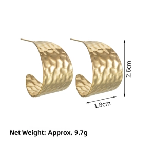 Detail view of gold C-shaped earrings with hammered texture and 2.6cm height measurement