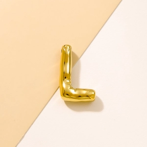Macro detail of a golden puffy letter L charm with a polished 3D balloon metal finish