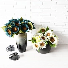 Artistic artificial sunflowers in blue and white with elegant ceramic flower vases
