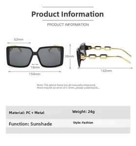 Detail of square sunglasses featuring bold gold metal chain temples and dark lenses