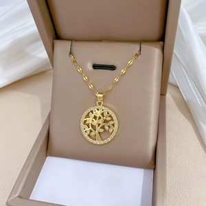 Elegant gold Tree of Life necklace with zircon inlay in a premium jewelry box gift setup