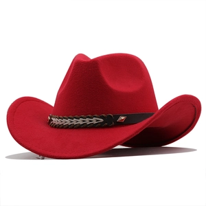 Detail of red wool felt cowboy hat with braided leather band and silver metal studs
