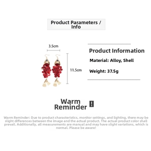 Detailed view of fish-shaped tassel earrings with dimensions 3.5cm wide and 11.5cm long