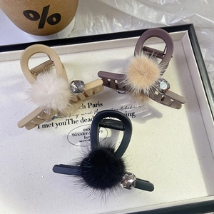 Three-piece plush hair claw clips in beige, brown, and black with rhinestones for women