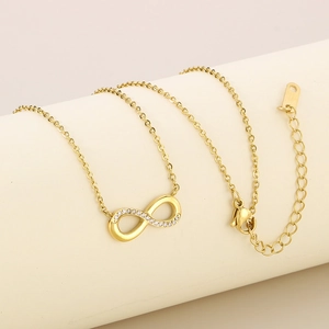 Luxury gold infinity necklace with micro-pave diamonds on a minimalist O-chain necklace