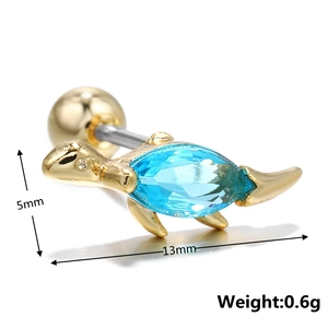 Detailed view of turtle ear bone stud with blue gem and screw ball backing