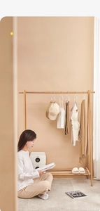 Versatile white S-shaped storage hooks hanging various hats and belts on wooden rack