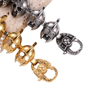 Gothic skull link bracelet in silver and gold stainless steel on natural stone base