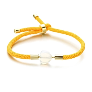 Adjustable yellow woven rope bracelet featuring a white heart stone and gold metal beads