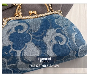 Detail of blue jacquard denim bag with rhinestone-encrusted gold metal frame and chain