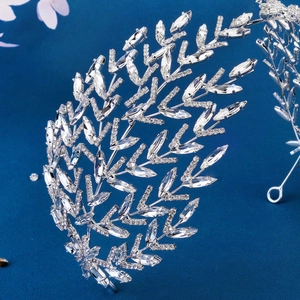 Luxury silver bridal headband with crystal leaf design and sparkling rhinestones for parties