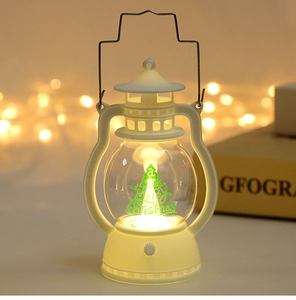 Detail of white vintage LED lantern featuring a green Christmas tree and warm glow