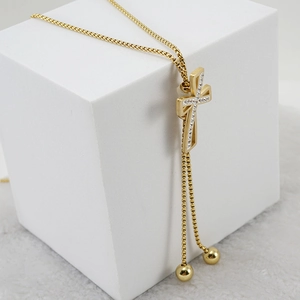 18K gold plated stainless steel cross necklace with zircon stones on white display
