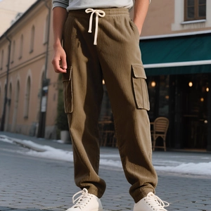 Mens vintage olive green corduroy cargo pants with drawstring waist and pocket details