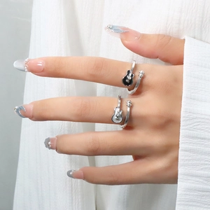 Adjustable silver guitar rings with black and white enamel and sparkling rhinestones
