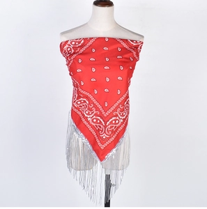Detail of red paisley bandana with silver sequins and decorative fringe on a mannequin