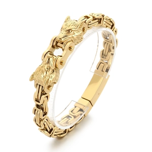 Men's gold titanium steel bracelet featuring bold double wolf heads and chunky chain link
