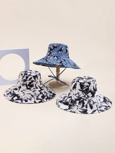 Detail view of double-sided wide brim cotton fisherman hats with vintage floral patterns