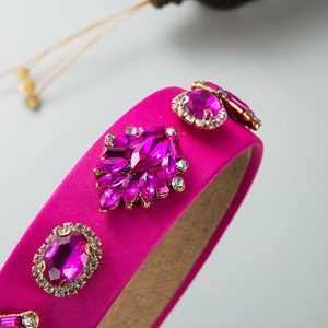 Detail of fuchsia baroque headband with purple gemstones and fine crystal inlay