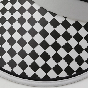 Close-up of the black and white checkerboard pattern and edge detail on the sun visor
