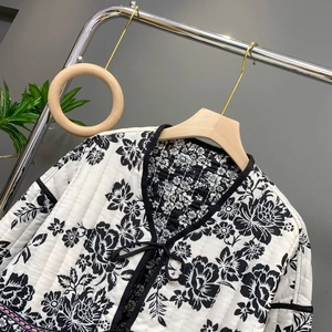 French vintage quilted jacket with black and white floral print and tie collar